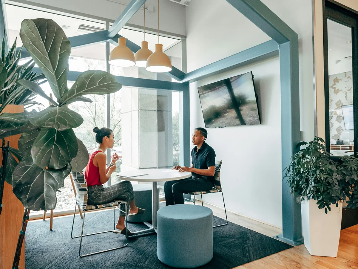Small business owner meeting with a Business Boosters web consultant in a modern New Jersey office