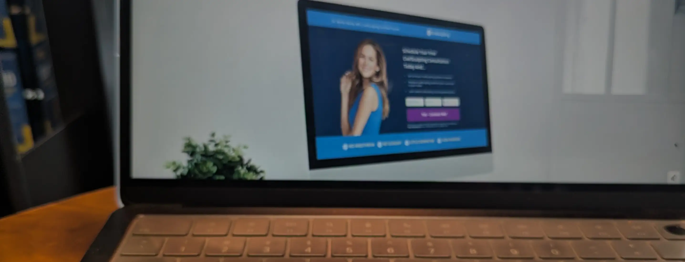 Close-up of a laptop screen displaying a custom website design