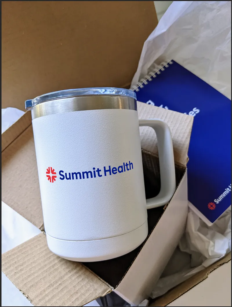 Corporate gift set with stainless steel tumbler, custom printed notebook in branded packaging box