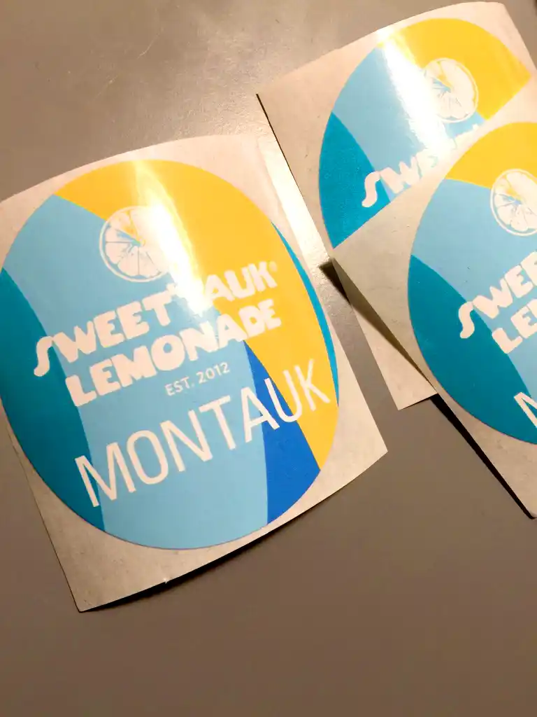 Custom designed round promotional stickers for food service brand marketing campaigns