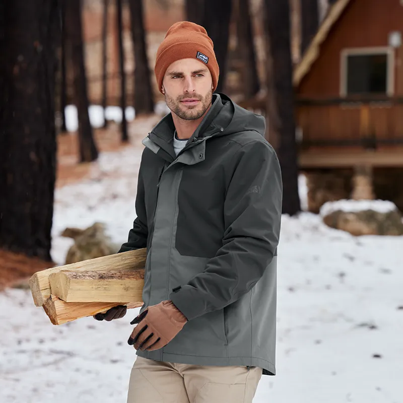 Man wearing an Eddie Bauer insulated hooded jacket outdoors in winter