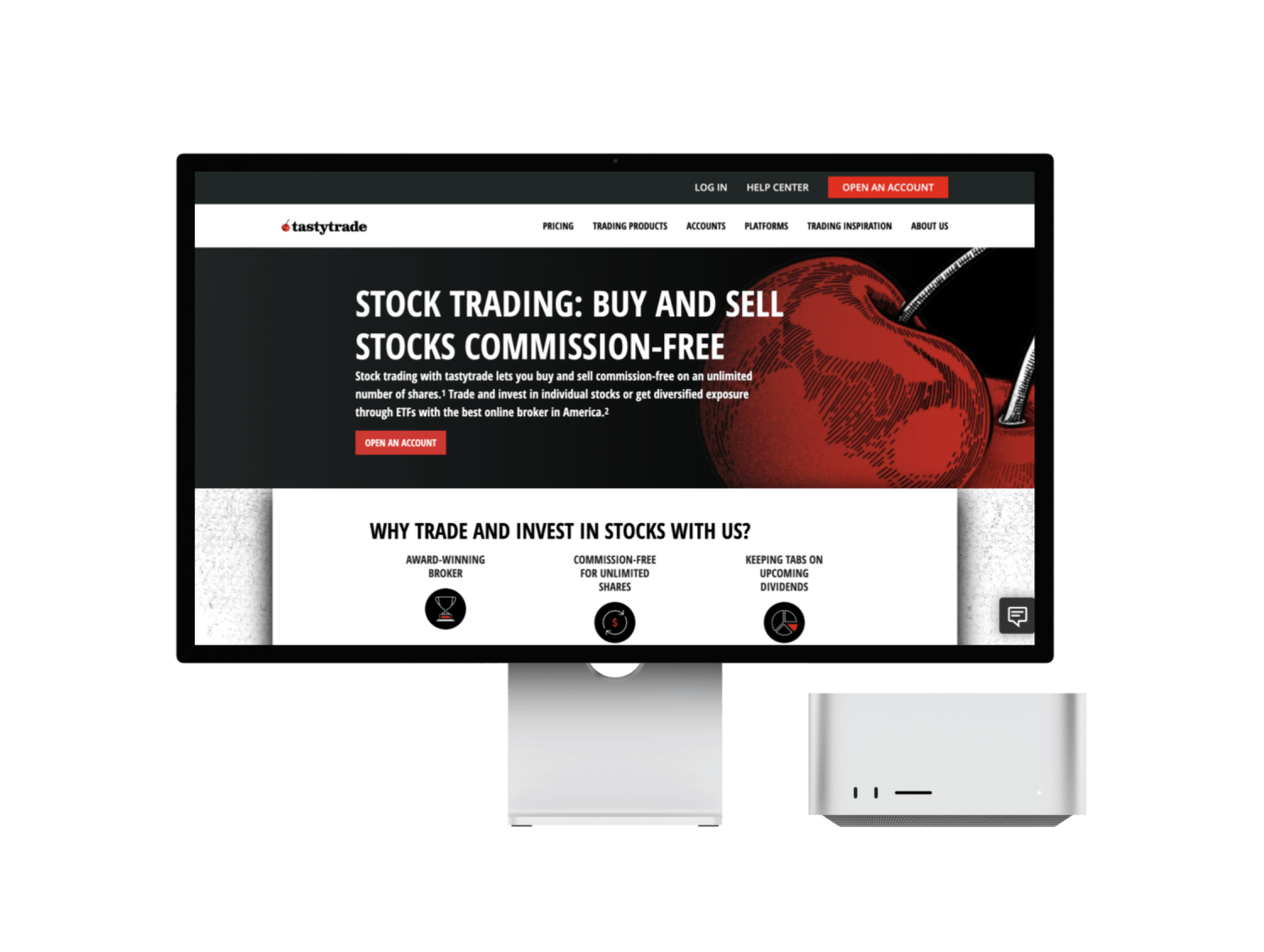 Desktop monitor displaying a stock trading website with messaging about commission-free trading, account signup, and investment features.