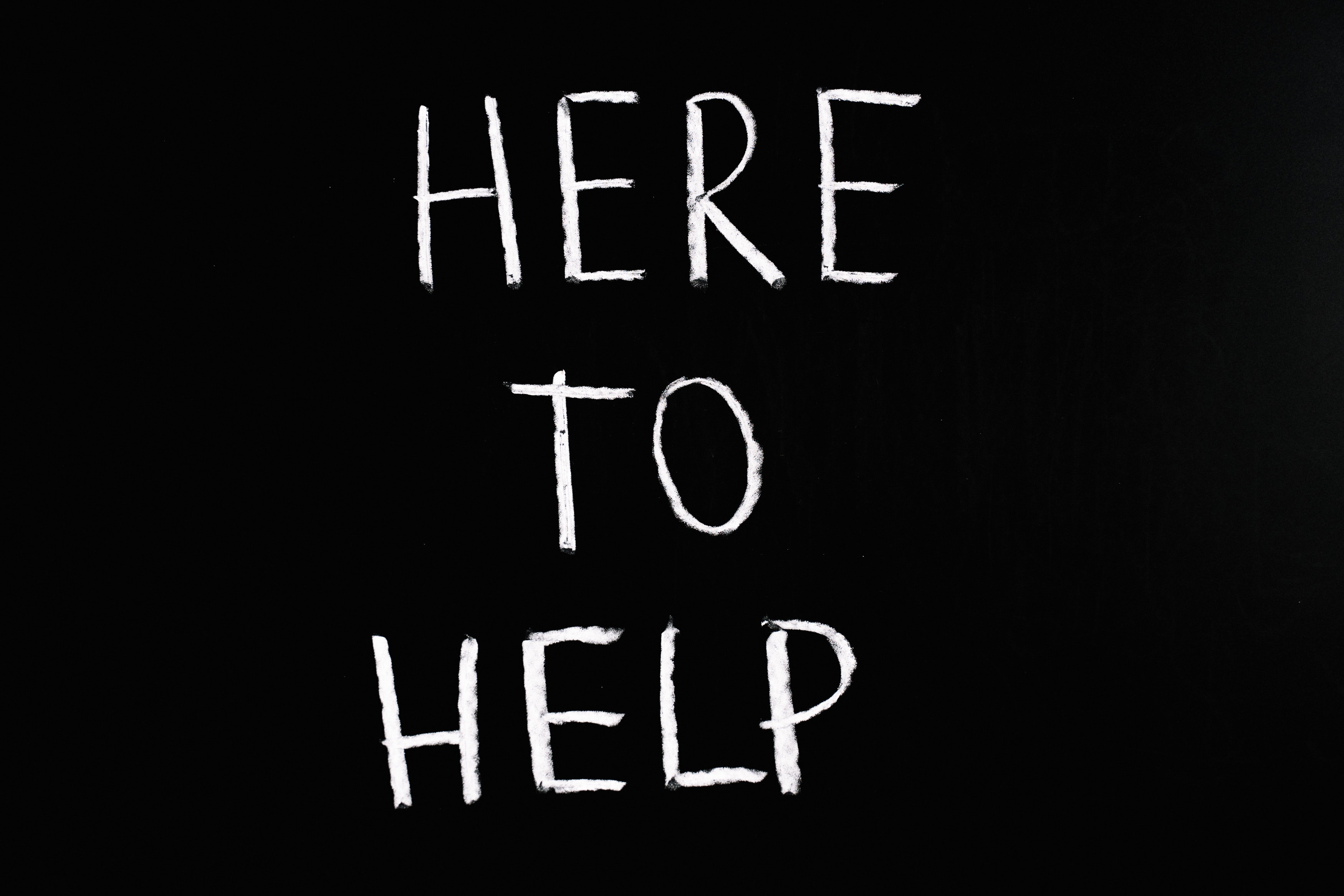 An image with the phrase here to help