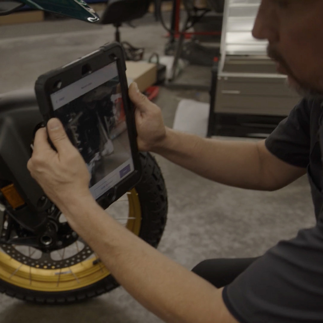 A technician making a Quik Video on a tablet