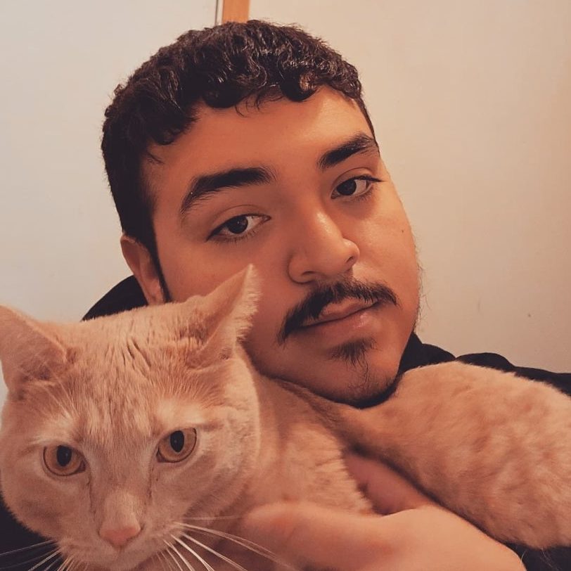 Mexican man with orange cat.