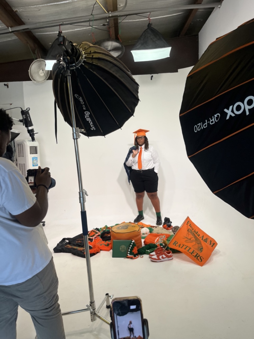 Tallahassee Imperial Studios - FAMU Graduation Shoot Studio Rental with studio lights and cyclorama wall.
