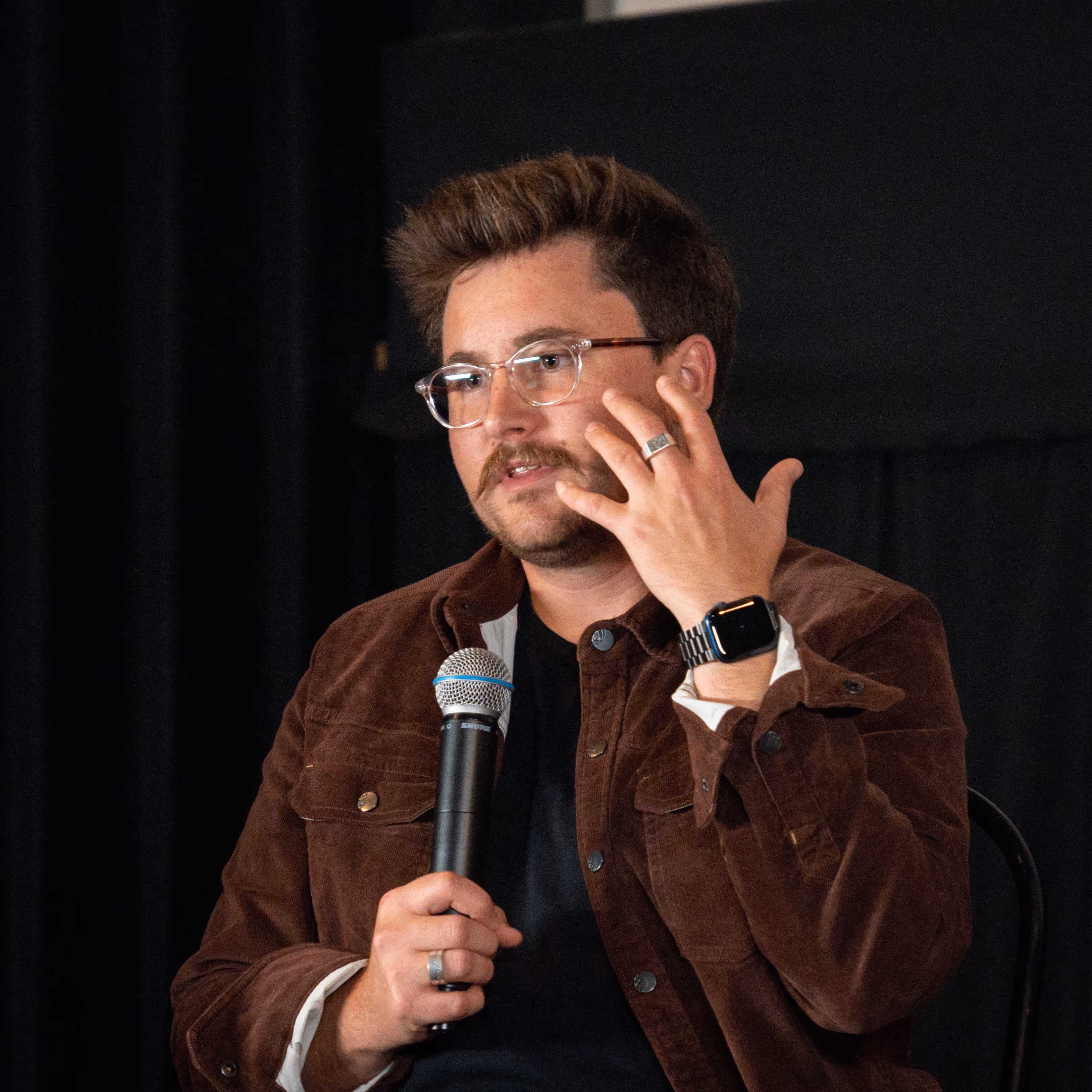 image of a man speaking to a crowd