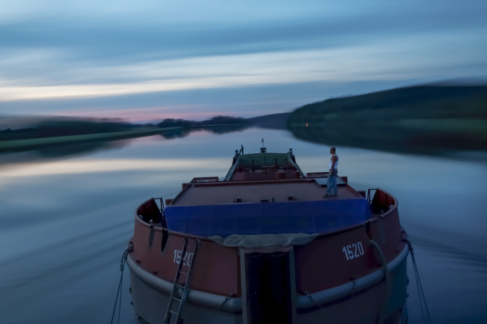 The last hour of work of river sailors on a ship, from left Piotr Karpacz, Zbigniew Laskowski, on the river Odra in Poland.