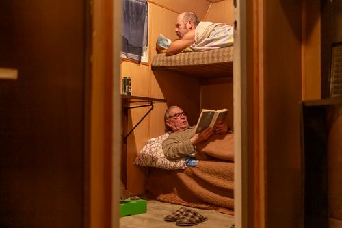River sailors get ready to sleep on their bunks, on the upper bunk Zbigniew Laskowski.