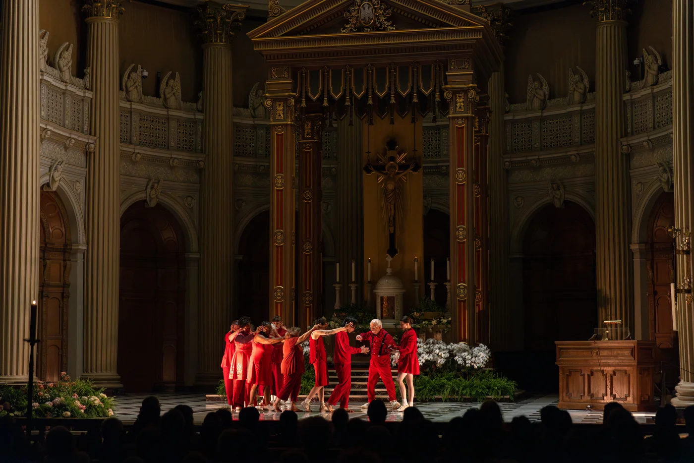Dance Generators on stage, hands rest gently on the heads before them, a gesture of trust and guidance, as the elder finishes a sacred conversation with God.