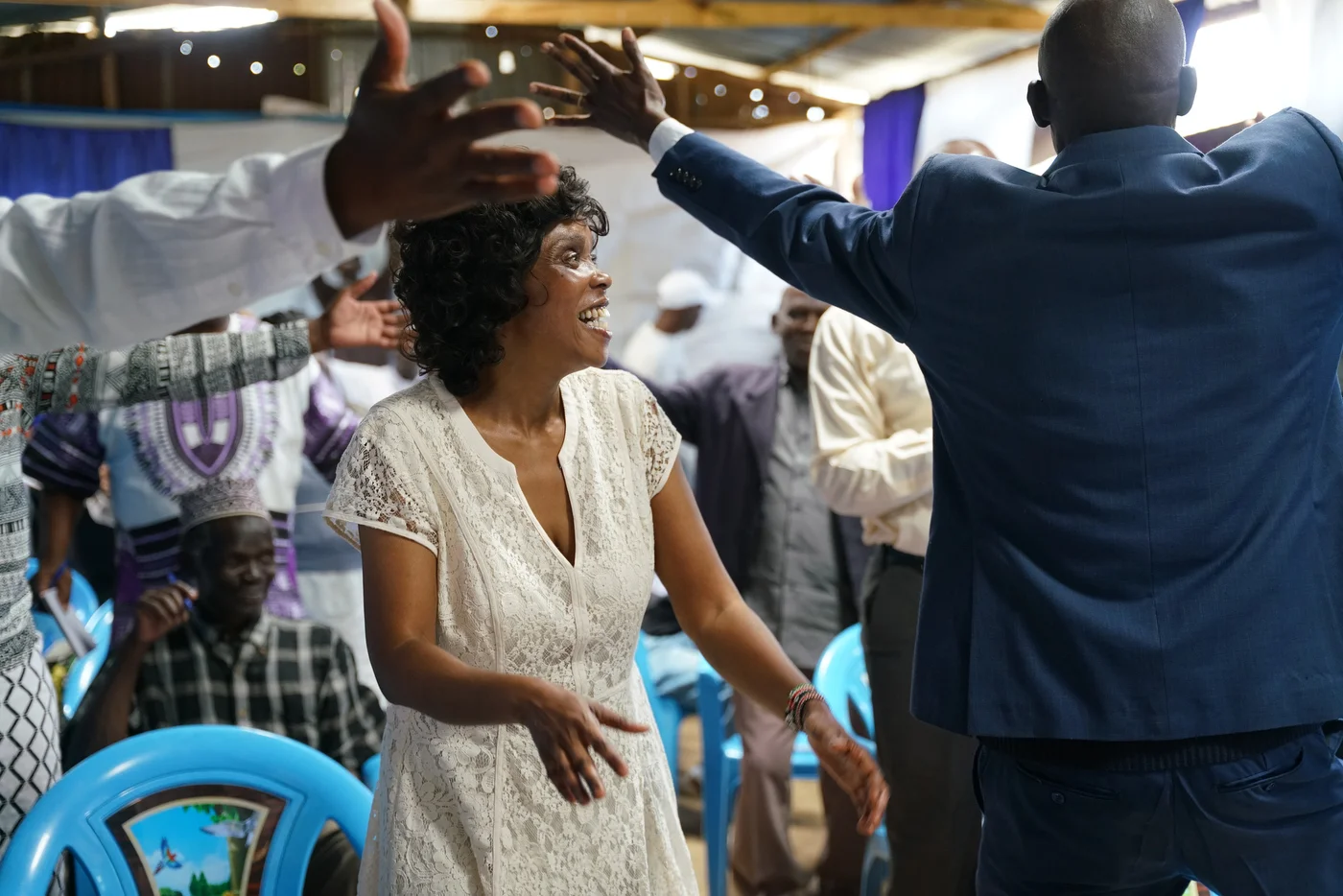 A woman dances in the center.