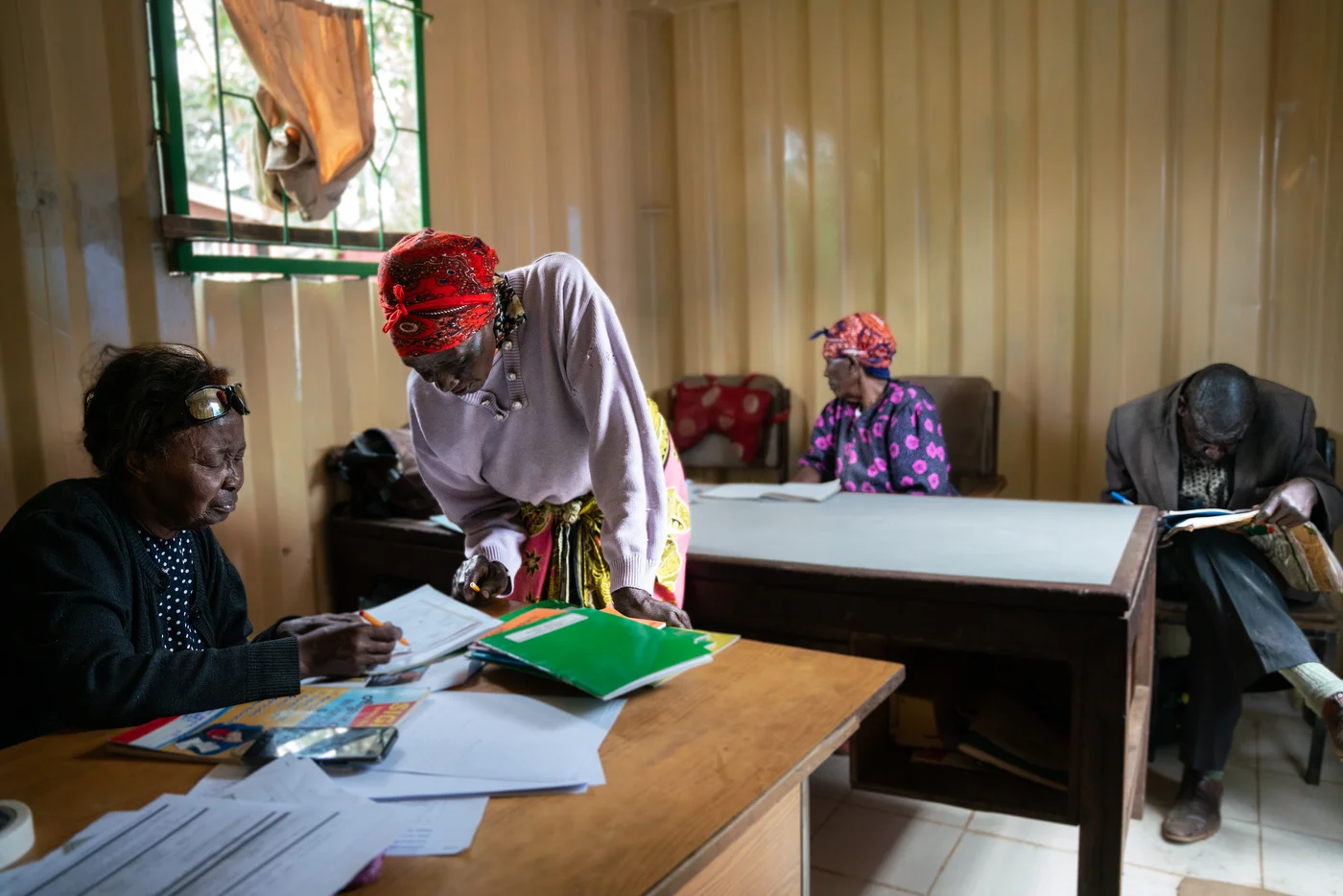Teacher Alice and her students during one of her many engaging lessons at Kibera Day Care Center for the Elderly.