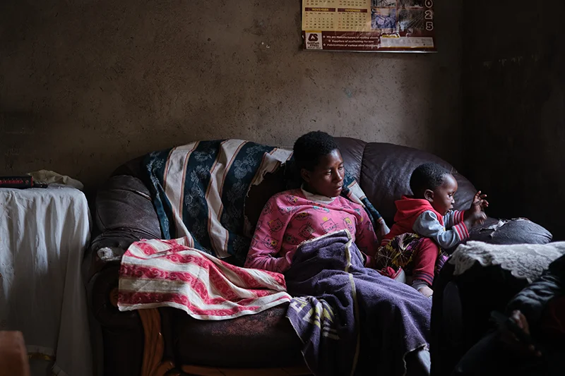 Chipo Mabiye, 22, plays with her daughter Adele, inside shelter Nhengo’s house. She also serves as a housekeeper assisting Shelta with daily chore and errands.
