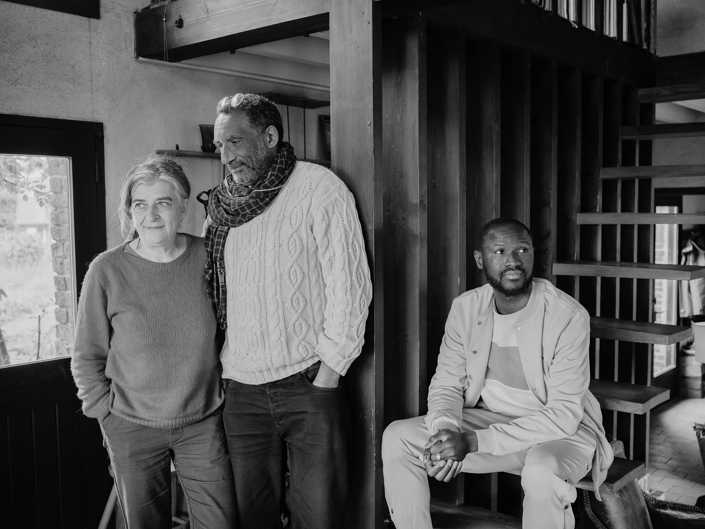 Alhassane with Arianne and Valéry in their home in Vattetot-sur-Mer. Though now independent, he spent long periods with them and continues to visit, sharing intimate moments and maintaining a strong connection.