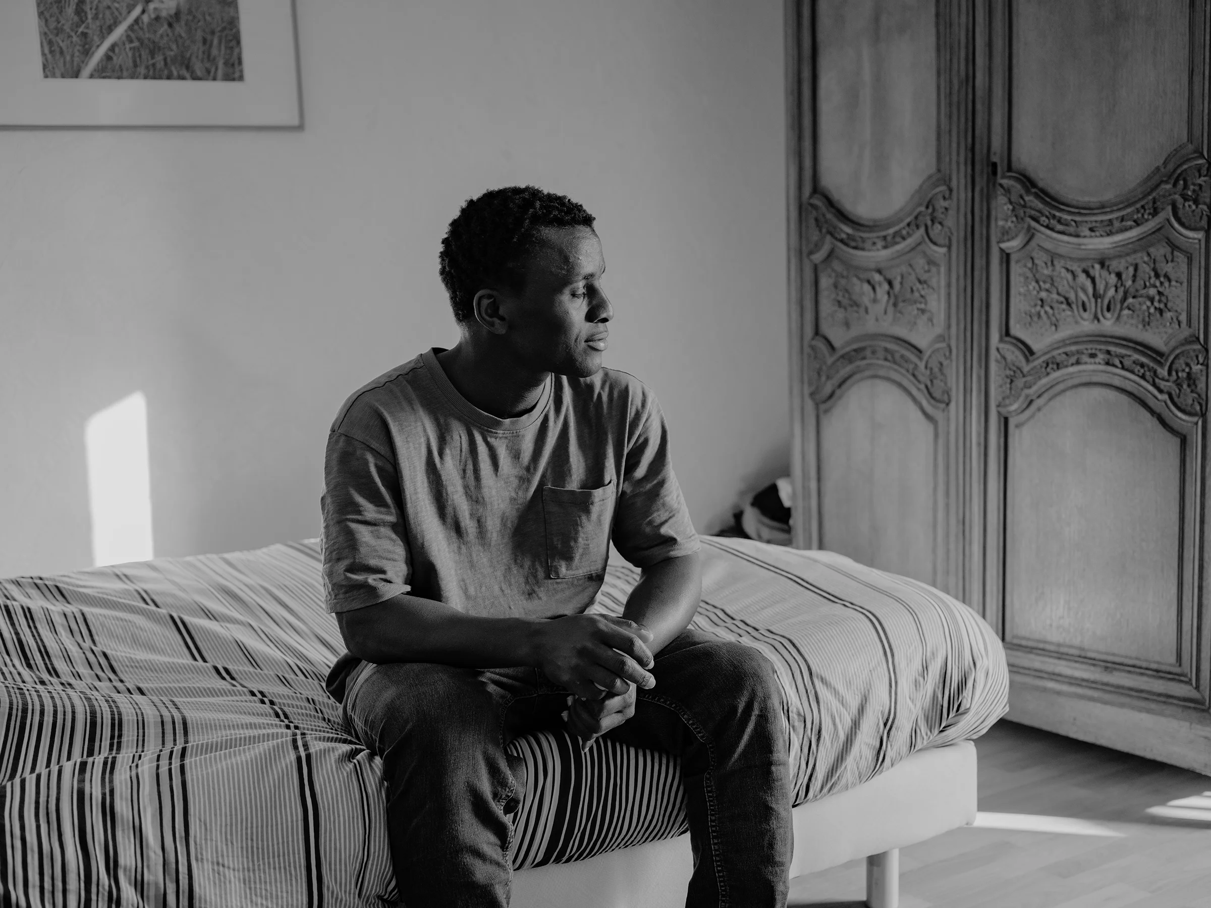 Ousmane16-year-old, in his tidy room at Marianne’s home, where he stayed briefly before moving between other families.