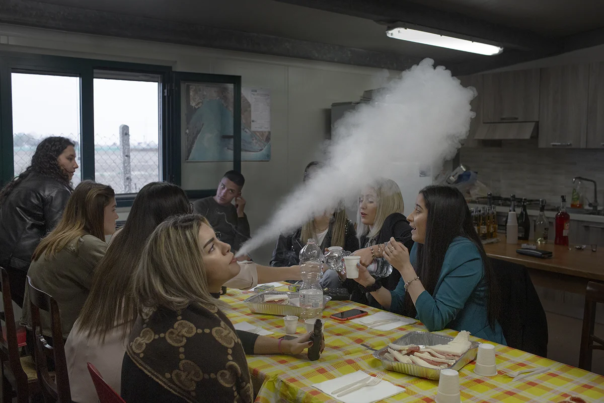 Alessia Turri, a young clam fisherwoman, celebrates her birthday with friends and colleagues, most of whom work in the local clam-fishing industry.