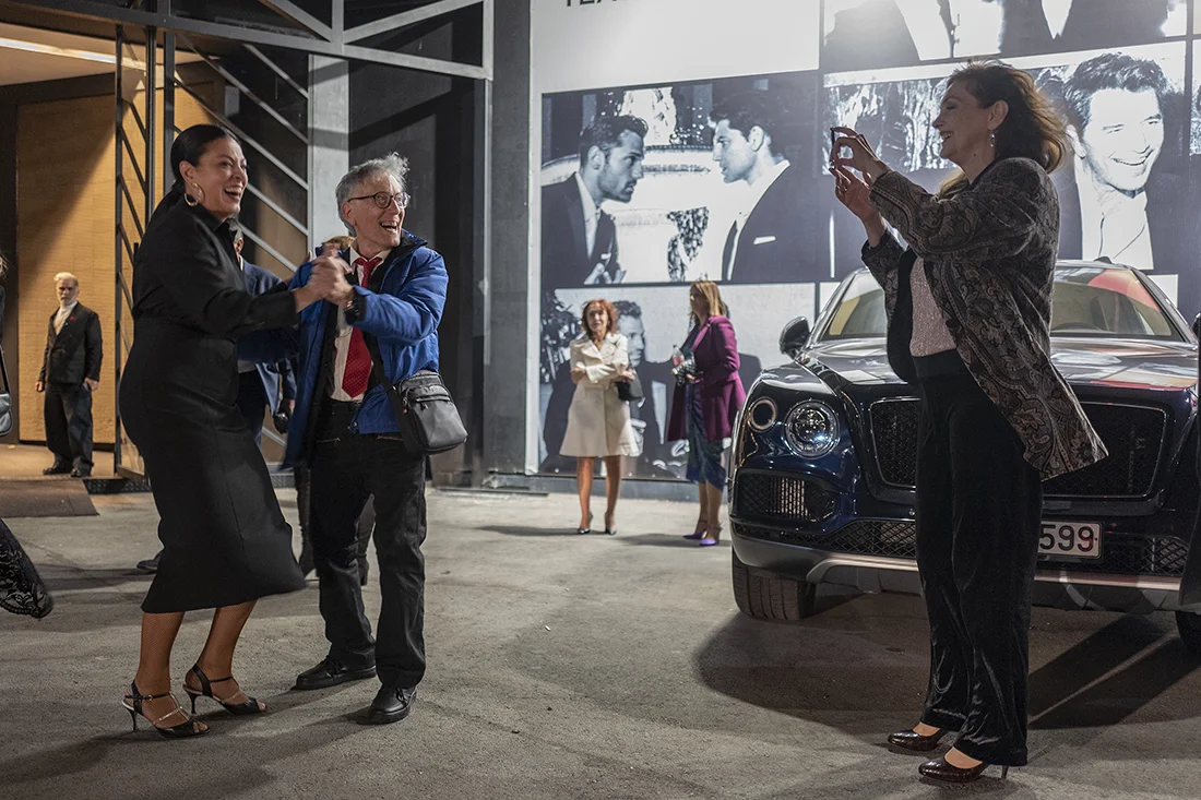 Dancing salsa outside the pageant venue with the Miss Universe Greece 1981 winner, while the Miss Universe Greece 1980 winner photographs them.