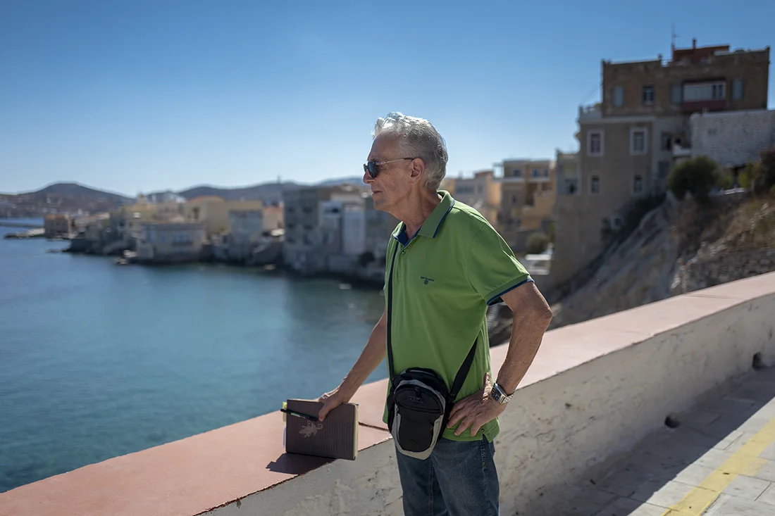 Grigoris enjoys the scenery of Ermoupolis on the island of Syros, which helps him organize and plan his next steps.