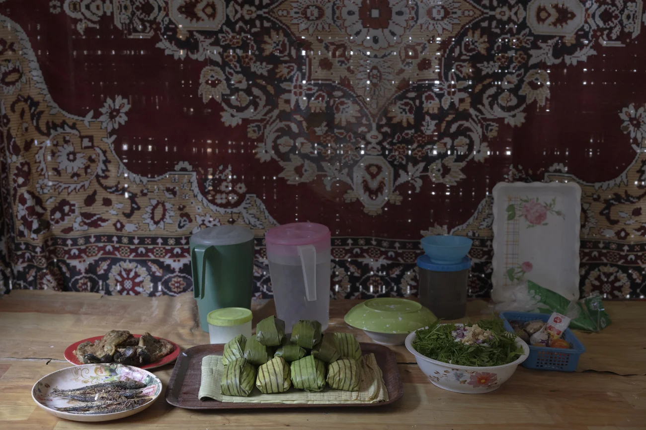 Food prepared for a community gathering, shared among residents as part of a collective moment of togetherness and celebration.
