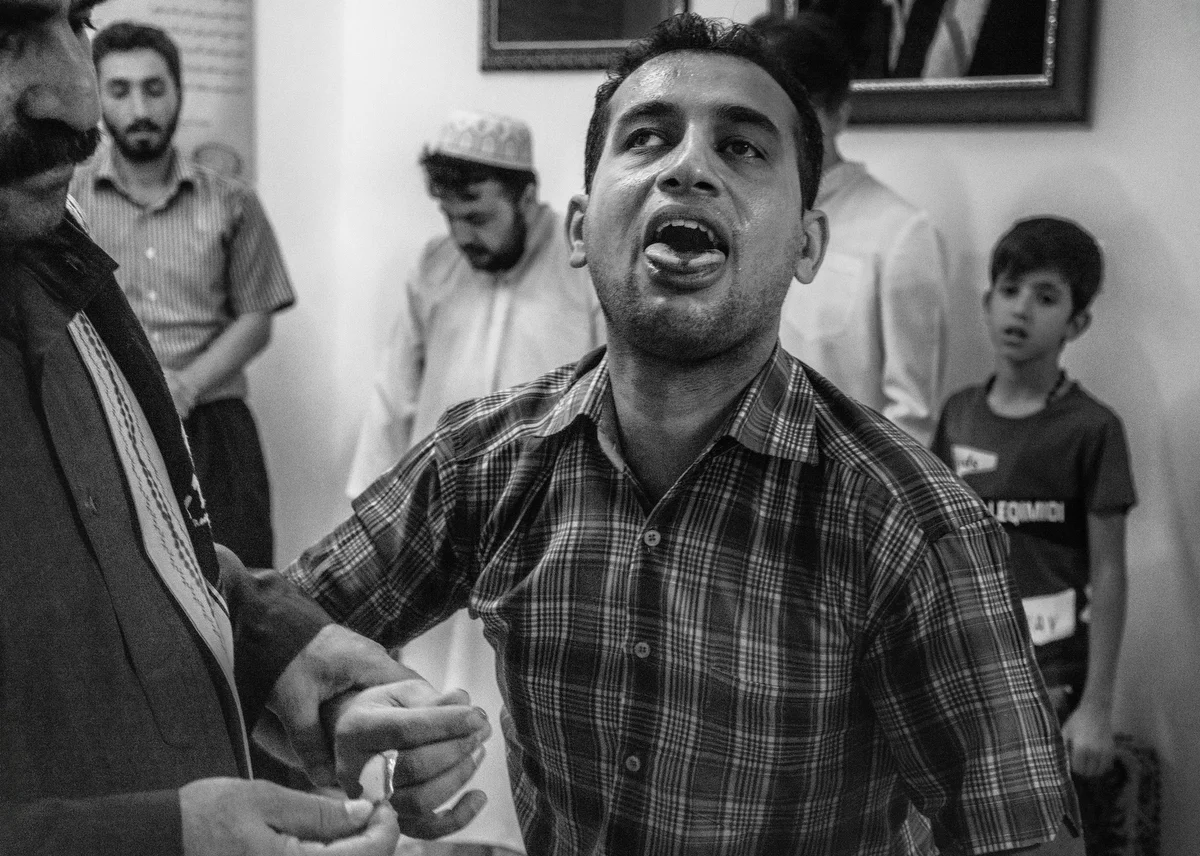 A dervish displays it after cutting his tongue with a glass during the ceremony.