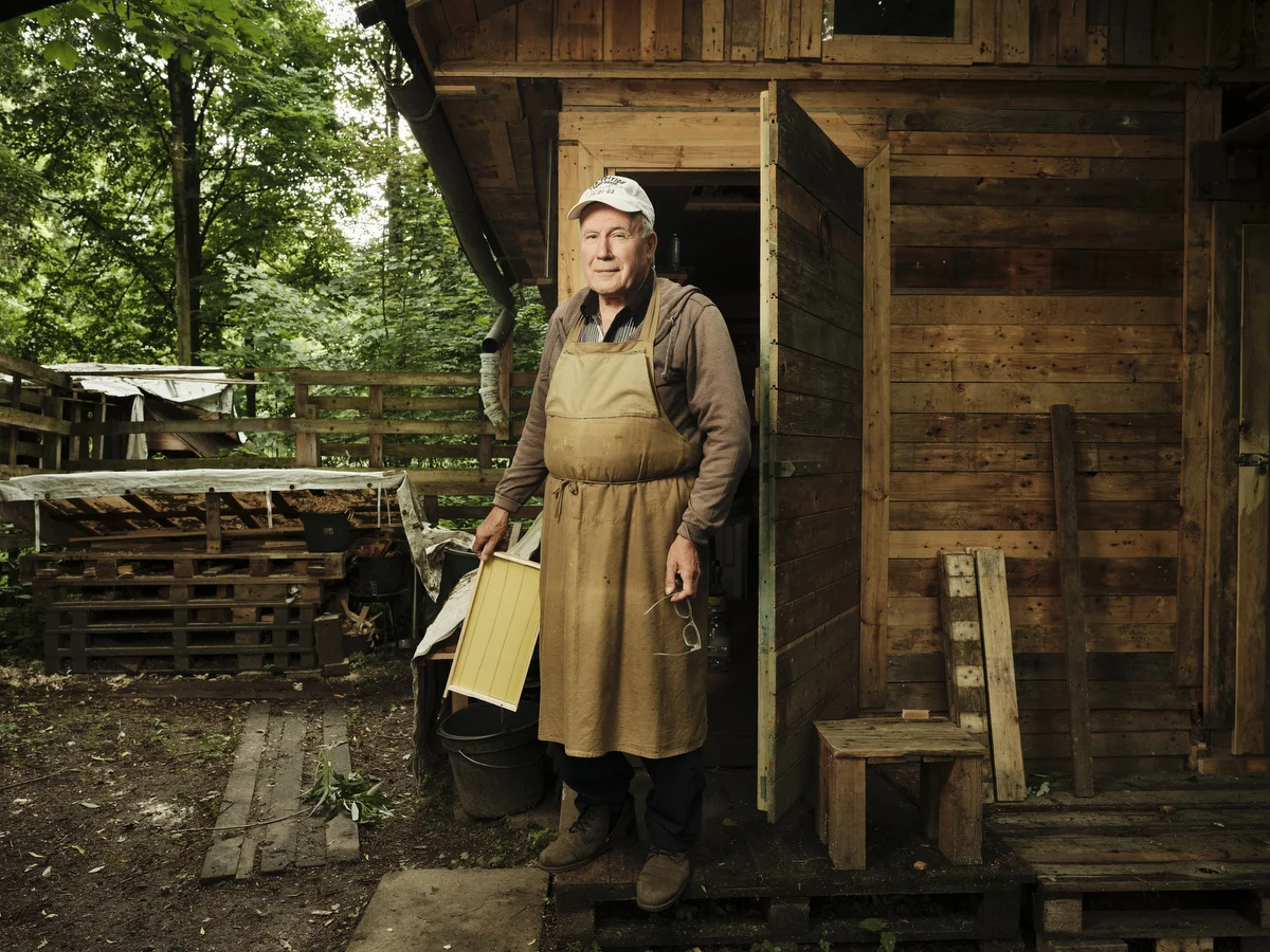 Volodymyr Olenchenko (73) in front of his homemade garden shed next to a recreation center in Bielefeld, where his beehives spend the winter.
