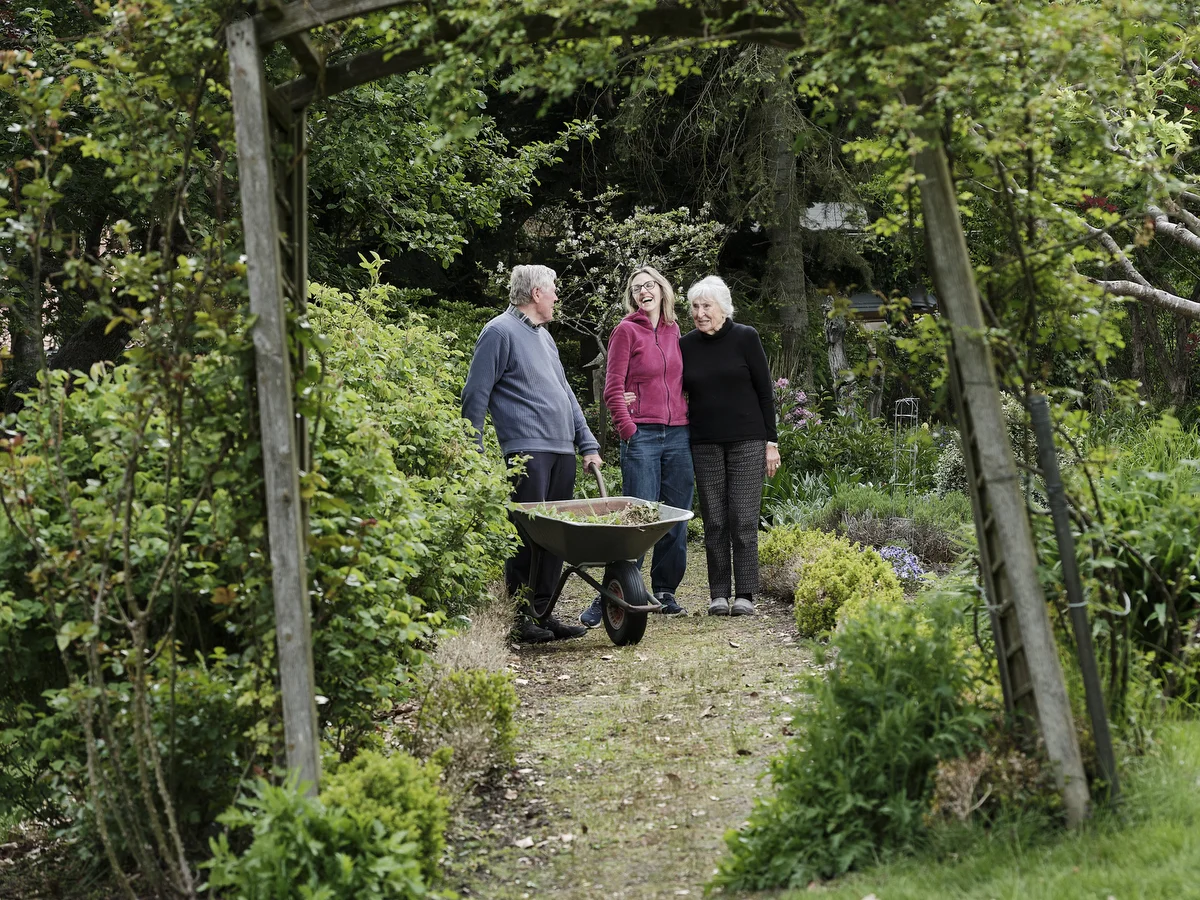 90 year old Brigitte Hildebrand tending her vast garden in Klein Zecher in northern Germany, her Friends Gerhard and Stella accompanying her.