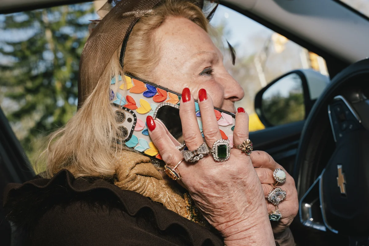 Paulette Dorflaufer takes a call while parked on the roadside after her crossing guard shift in Livingston, NJ .