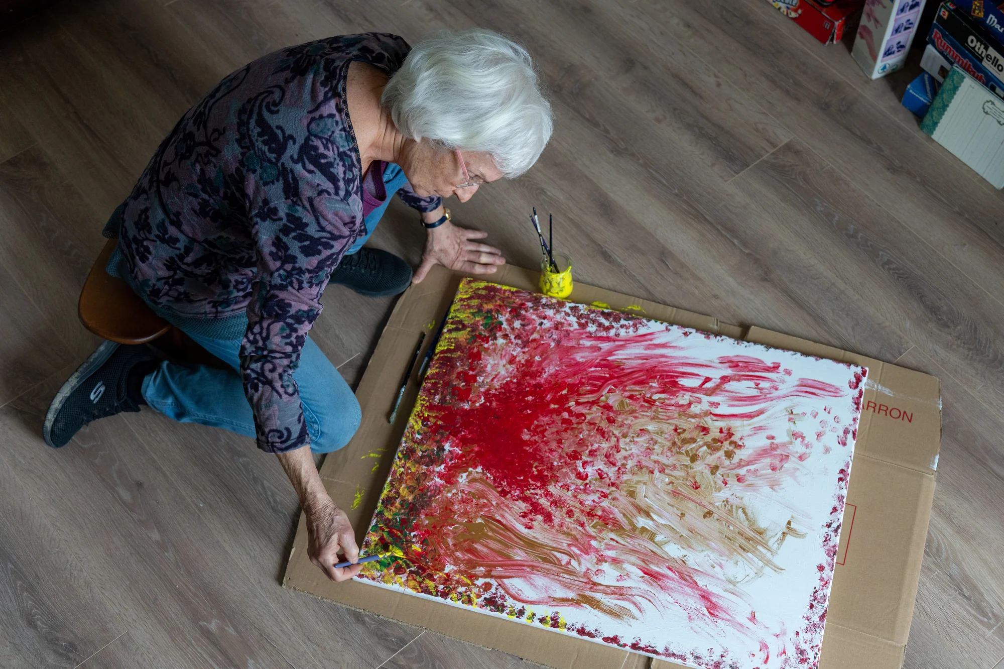 Camille paints abstractly at home, Toulouse, France 2026.