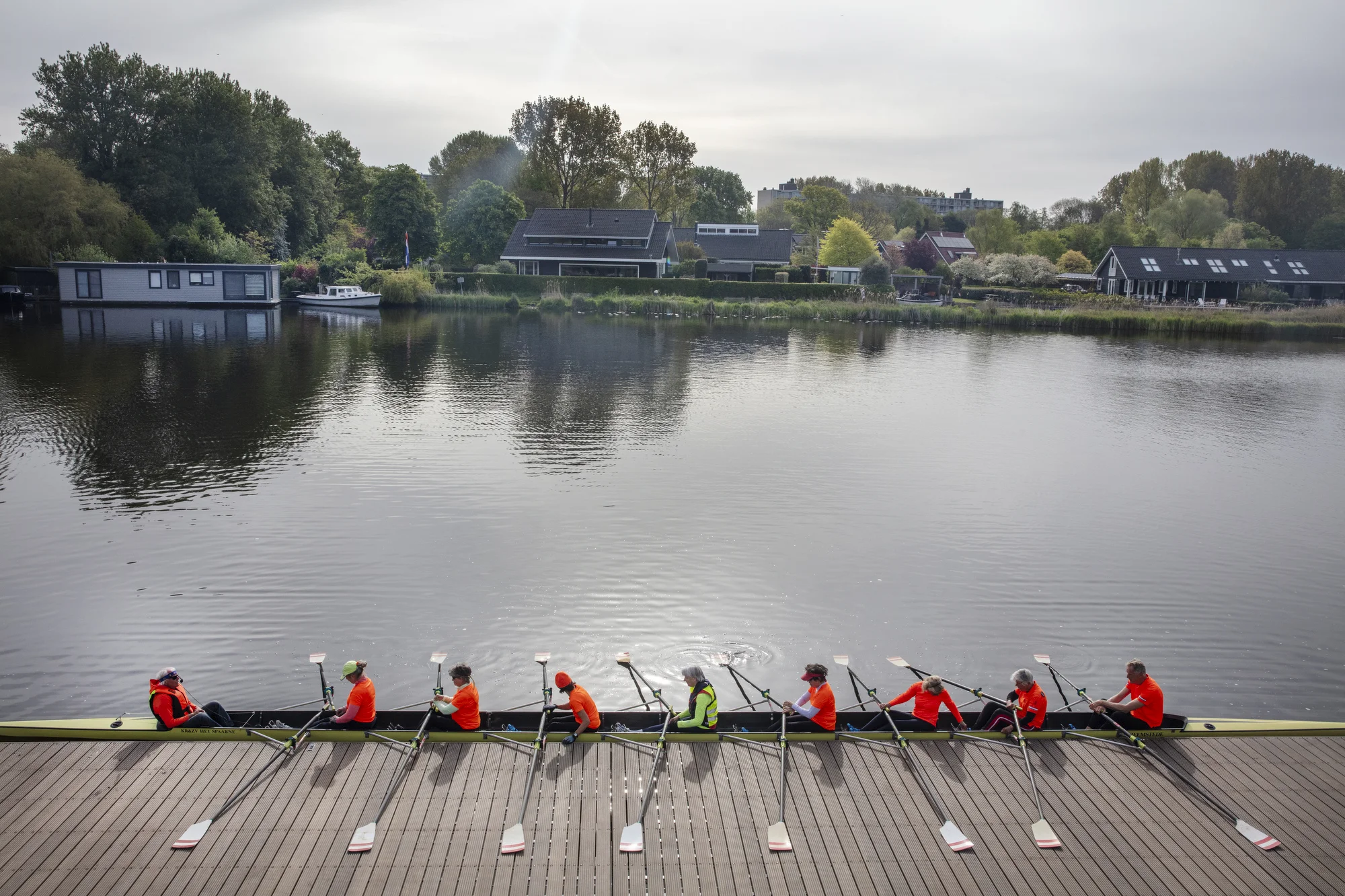 Ton van Schoonhoven with a group of rowers he coaches.
