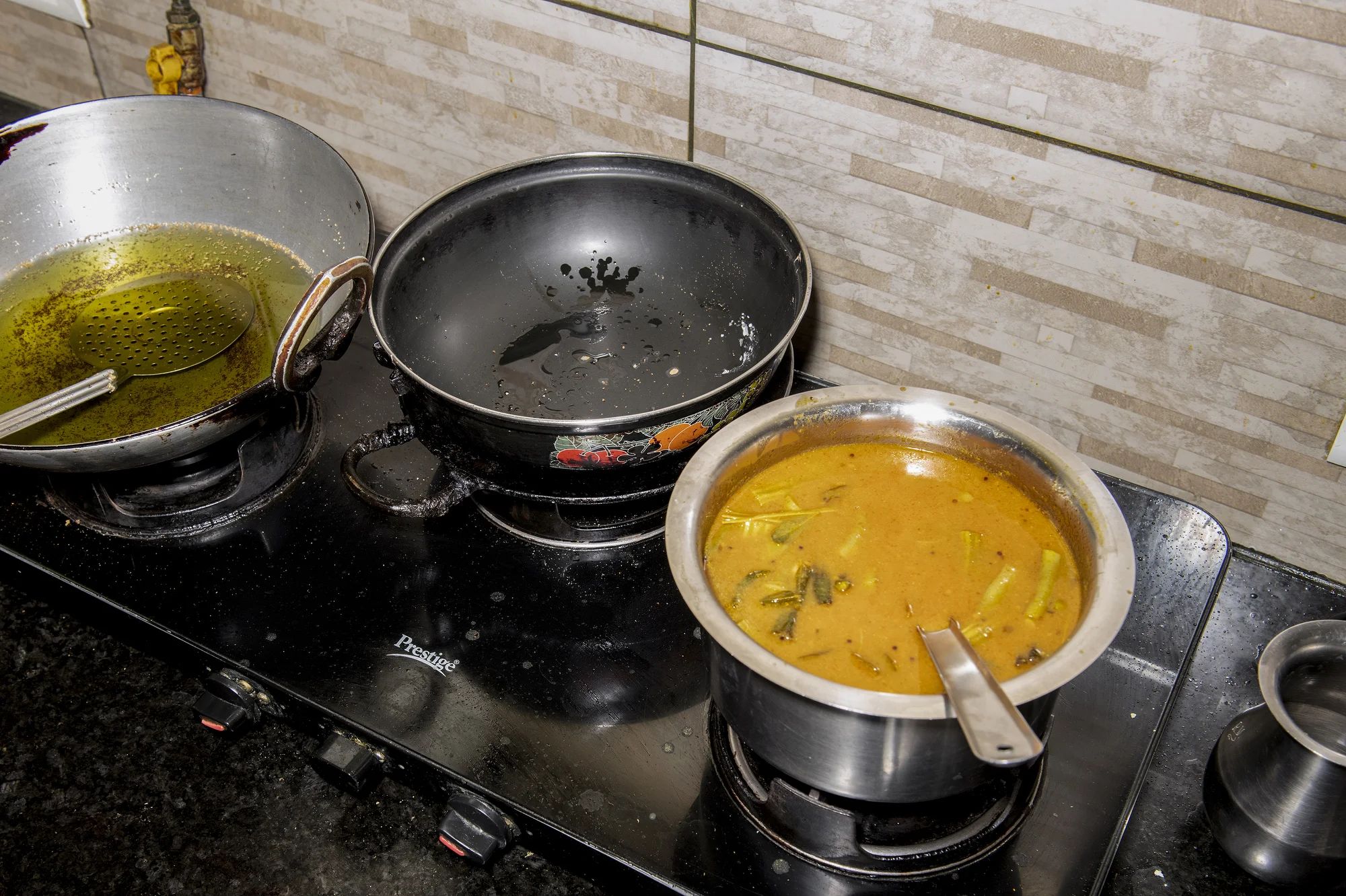 Sindhi curry prepared by Vandana G Talreja, 69, for a customer order in her home kitchen in Bangalore, India, on Aug. 23, 2026.