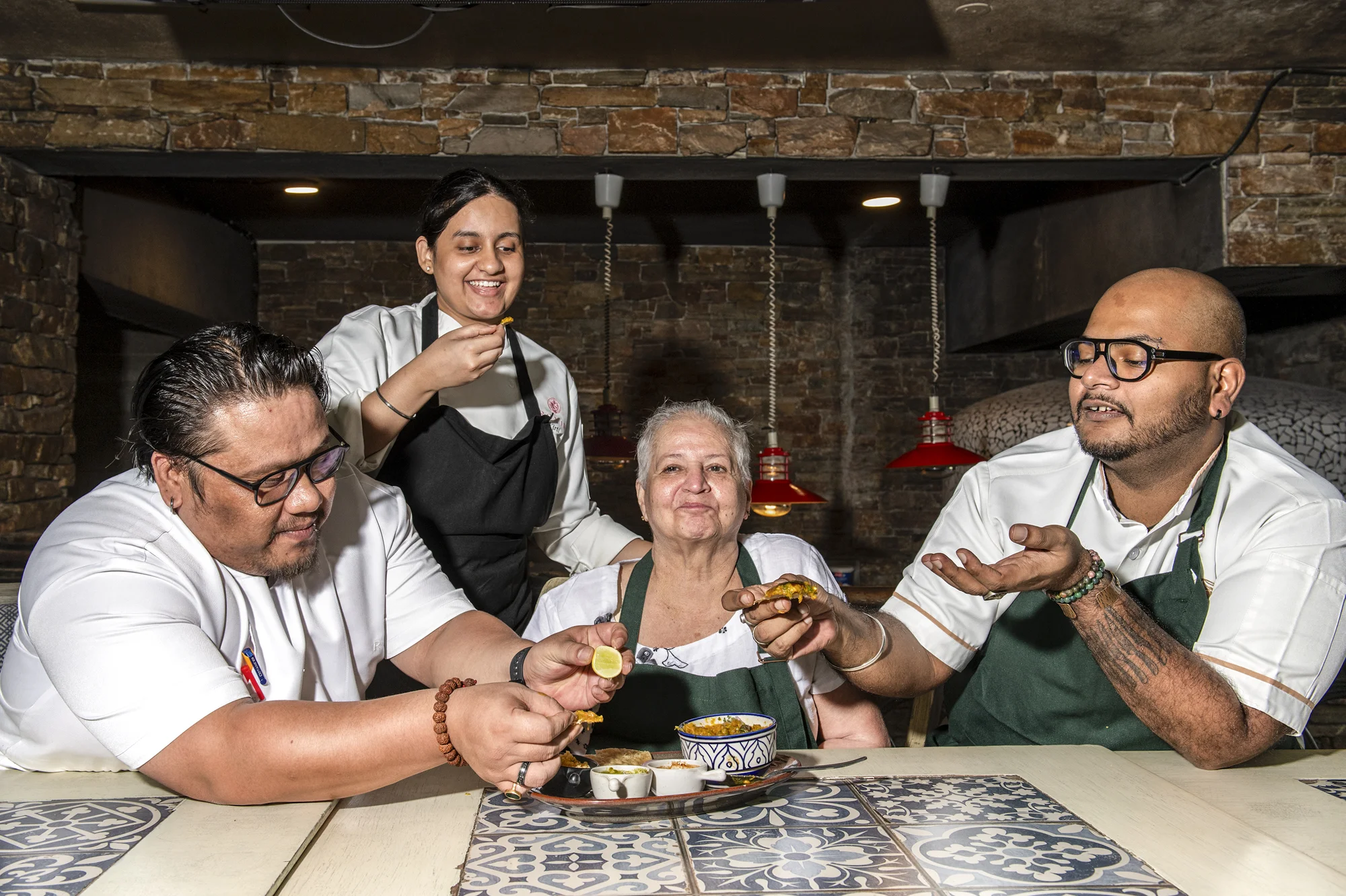 Chefs at Roxie taste Sindhi-style Dal Pakwan prepared by Vandana G Talreja, 69, in the restaurant’s kitchen in Bangalore, India, on Aug. 25, 2026.