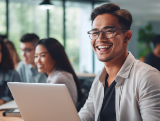 corporate professional laughing on laptop