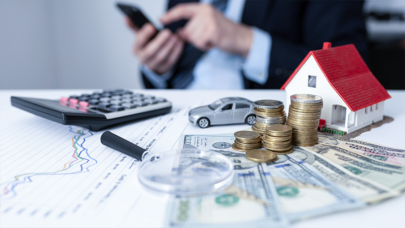 shared services finances, cash, coins, calculator, man on phone