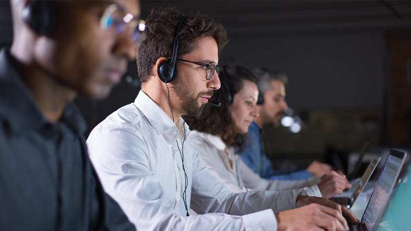 outsourcing, workers, working, with headphones on