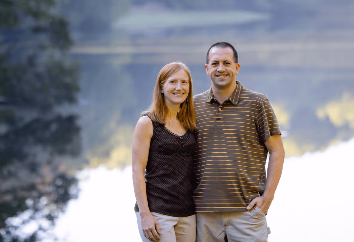 Couple smiling by lake