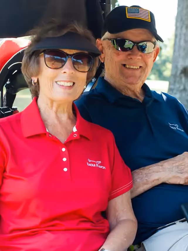 The Dewitts pictured in a golf cart