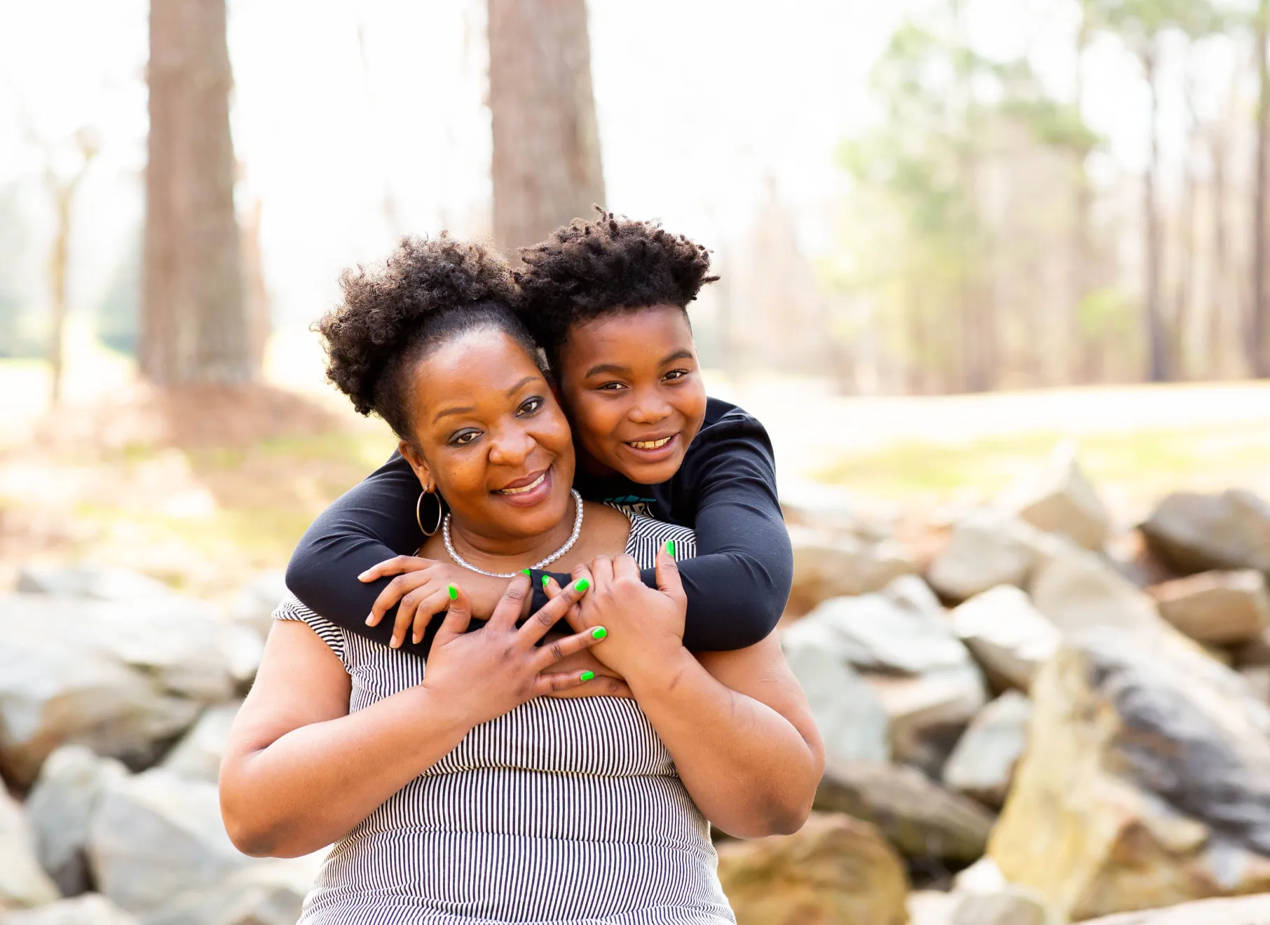 Mother and son give each other a hug at Eagle Ranch