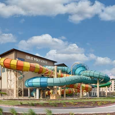 Photo of the outside of Great Wolf Lodge where the slides are coming out of the building.