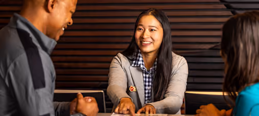 Pack Member helping guests at the front desk