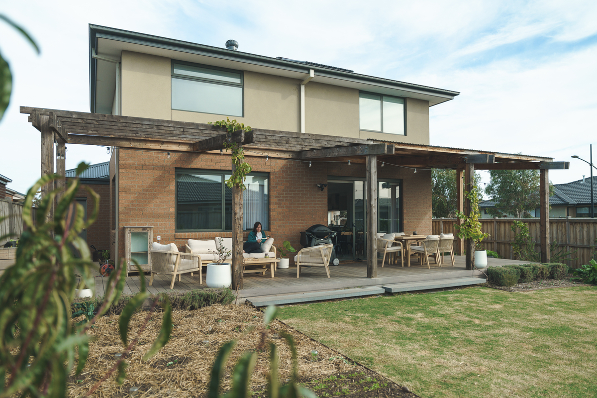 A sustainable wooden house with a garden