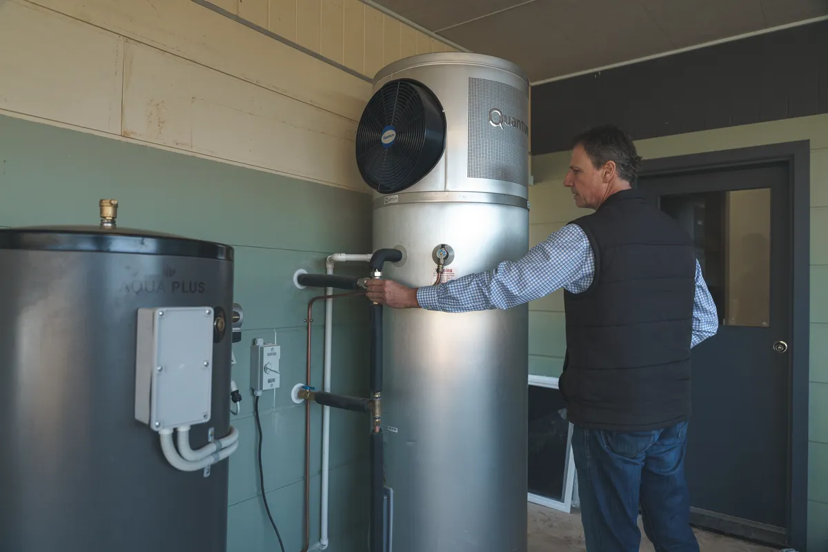 Ashley checks his heat pump water heater
