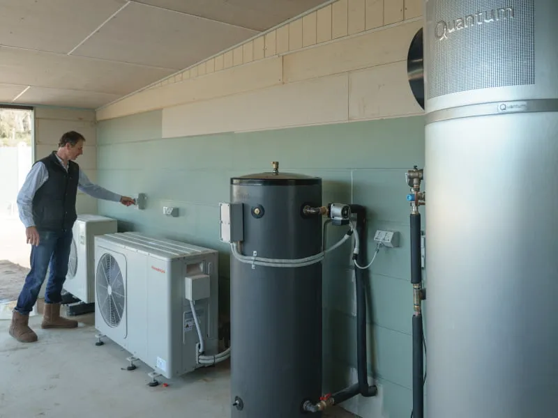 Ashley checks on their hot water pump and home battery system