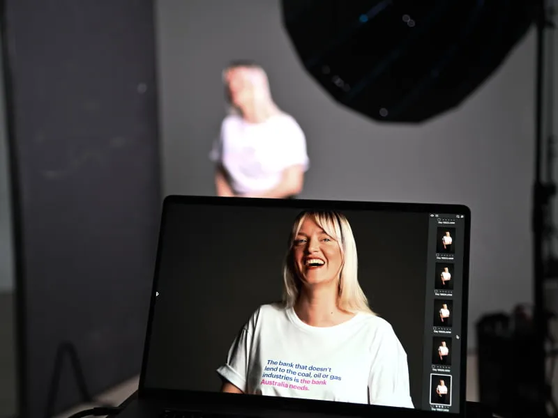 A computer screen with a photo of a person smiling on the screen.