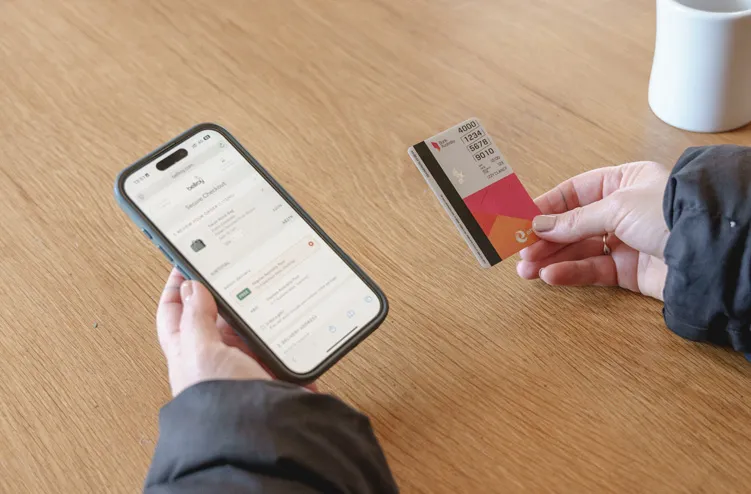 A person pays for a coffee using a card