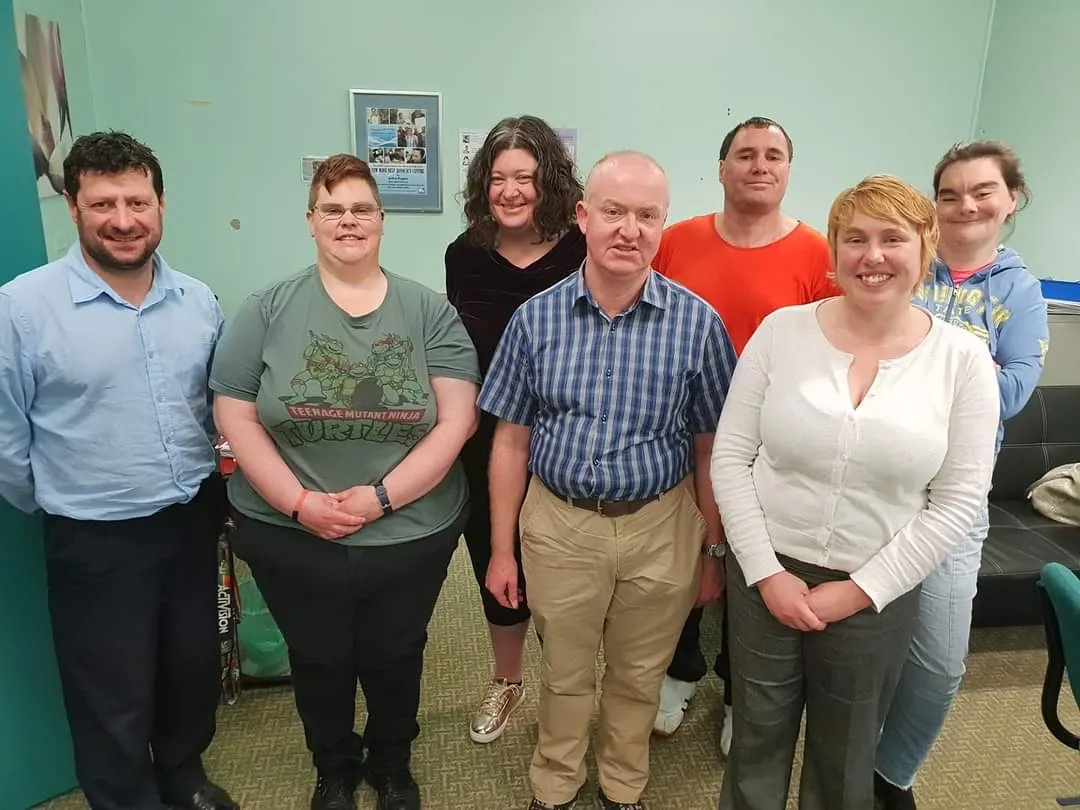 A group of people stand together