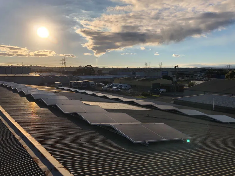 Solar panels on the roof of a large building