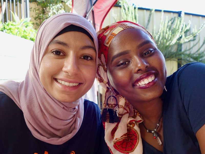 Two women smiling together