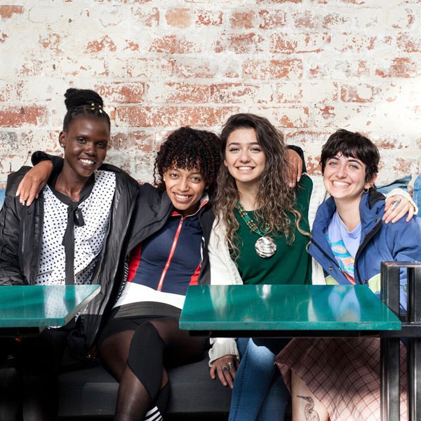 A group of students sit together in a classroom