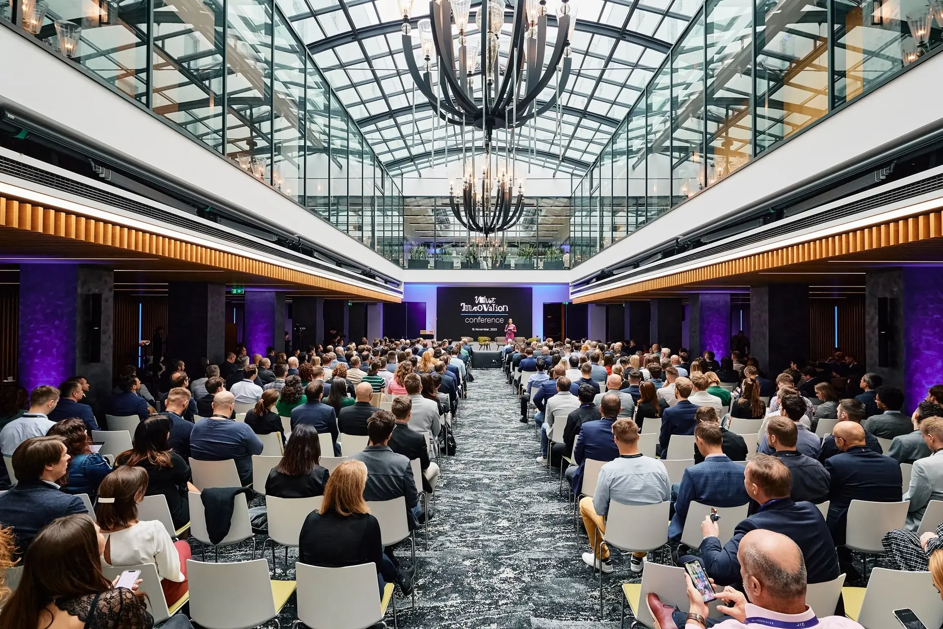 Screenshot of the Eventee mobile event app that shows the gamification leaderboard with attendee ranking based on the points they earned for using the app. There is a winner podium with three stands on top to highlight the best players.