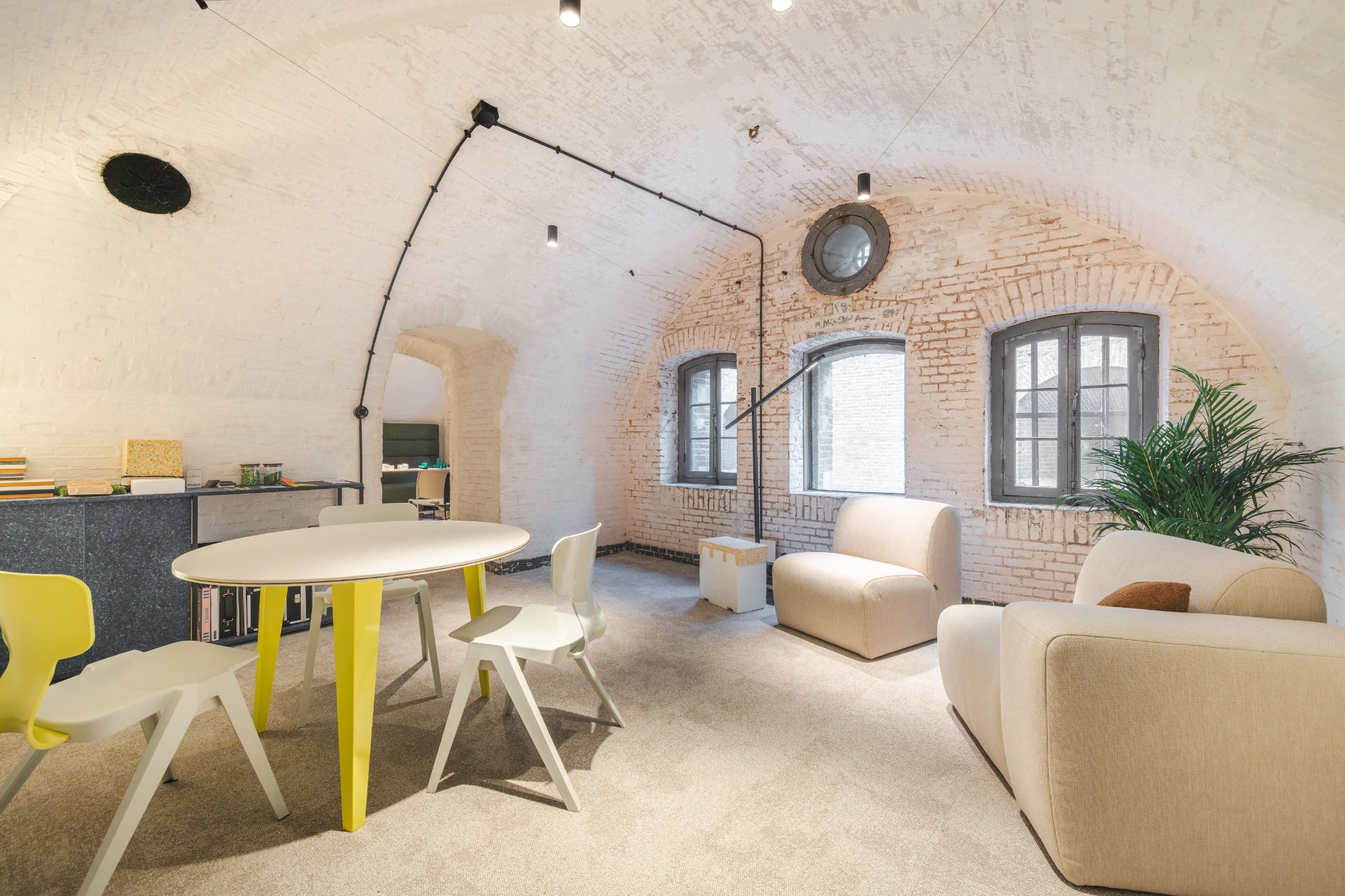 An image of designer Ineke Hans holding the chair as if it where to be recycled.